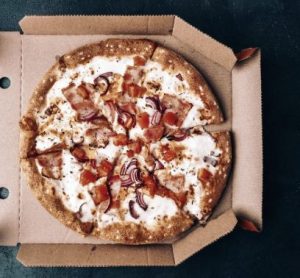 Pizza in a grease proof box