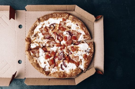 Pizza in a grease proof box